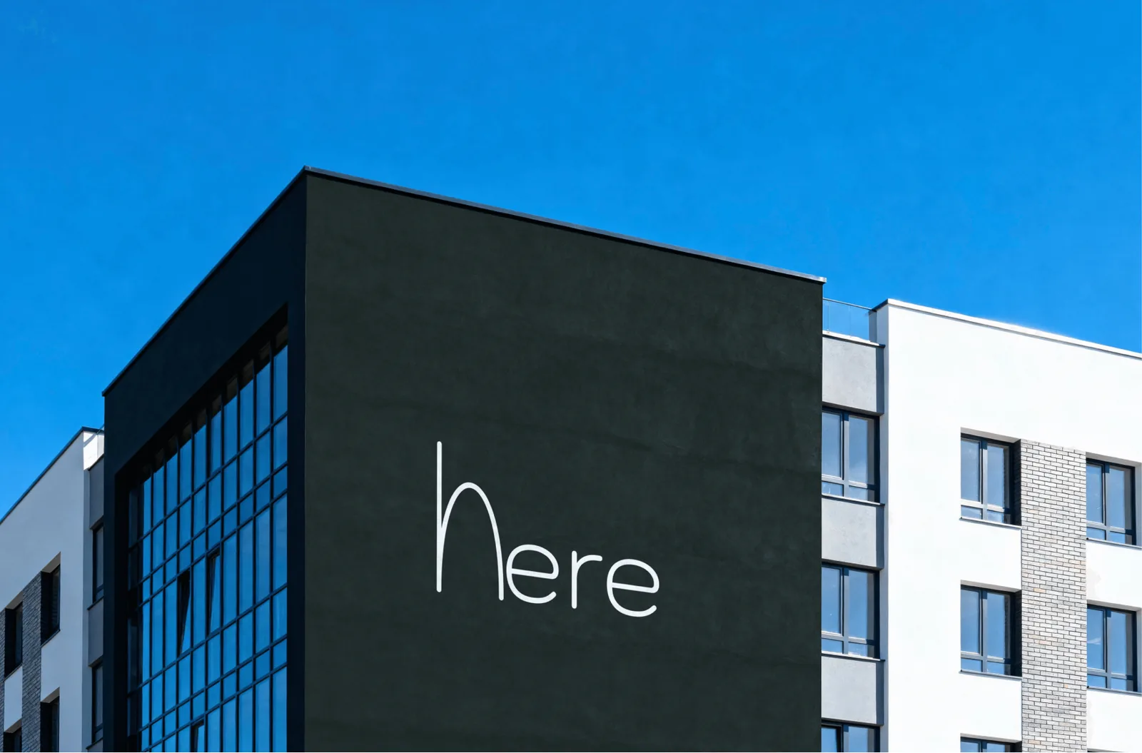 Rótulo de fachada con la «h» de Here